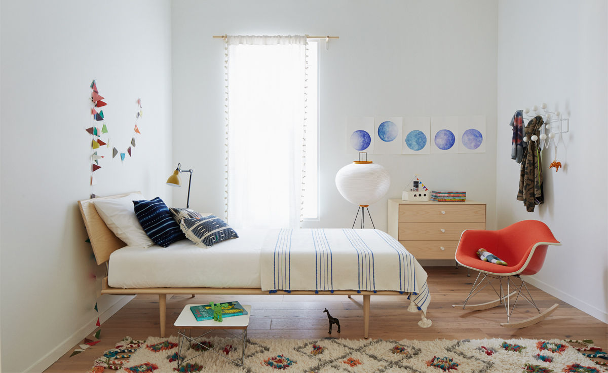 eames&reg; upholstered armchair with rocker base