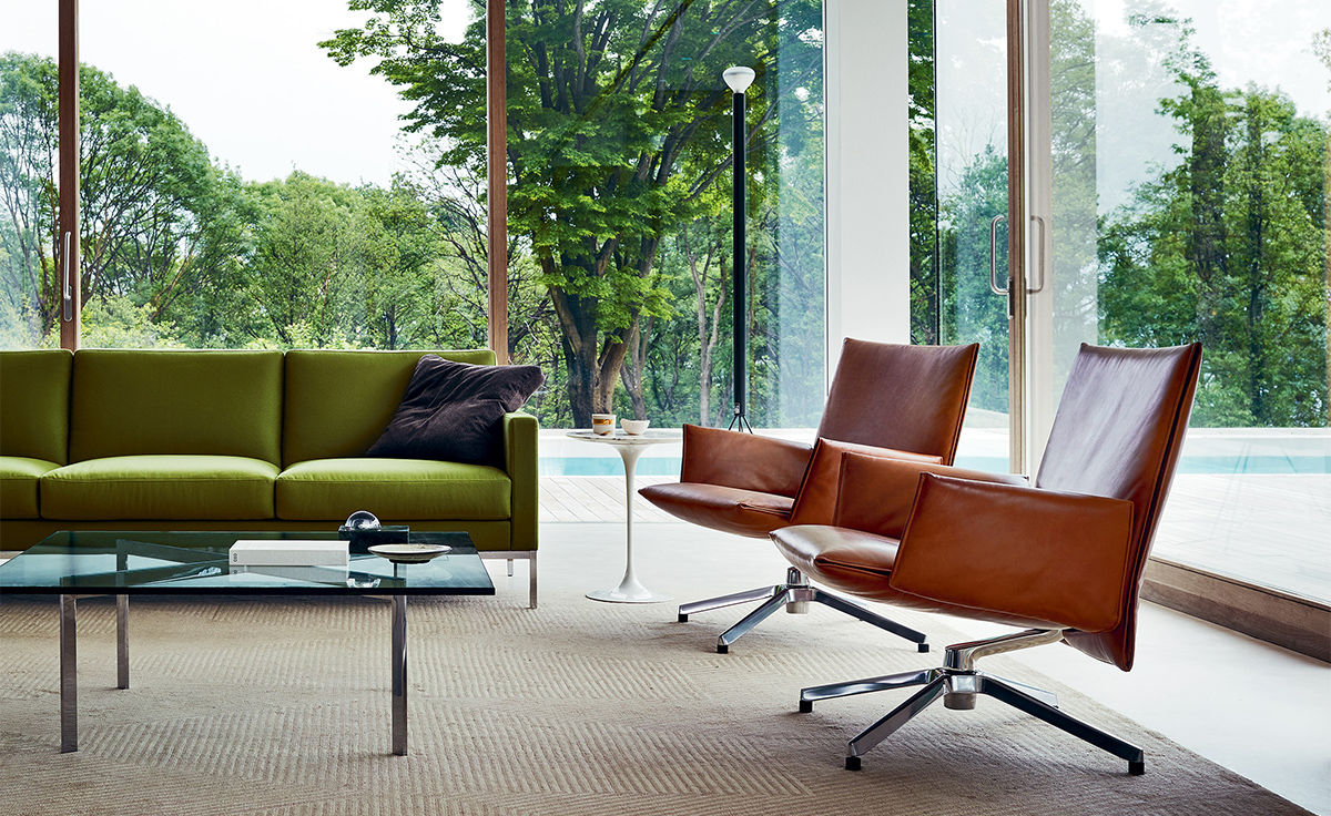 pilot low back lounge chair with upholstered arms